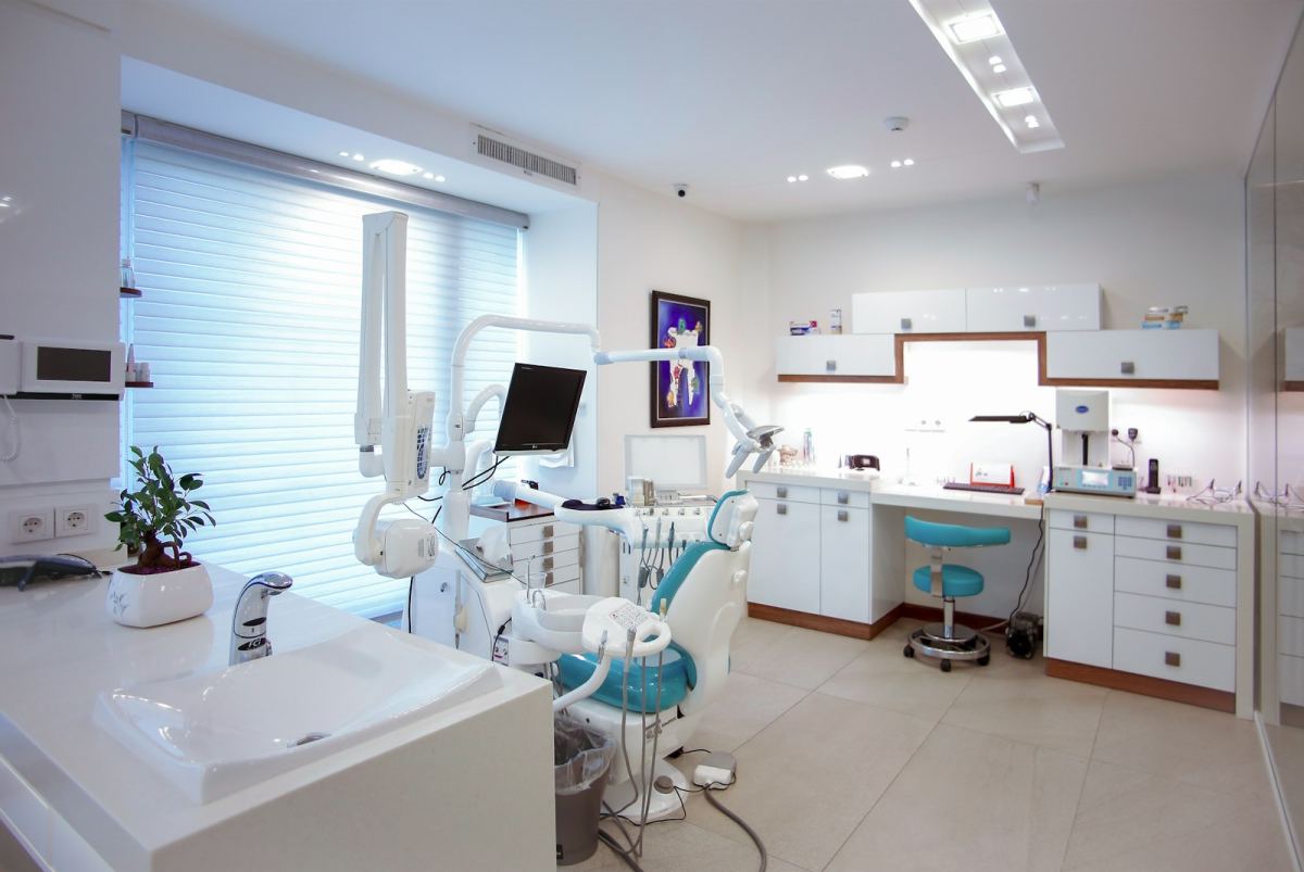 Modern dental clinic treatment room with digital equipment
